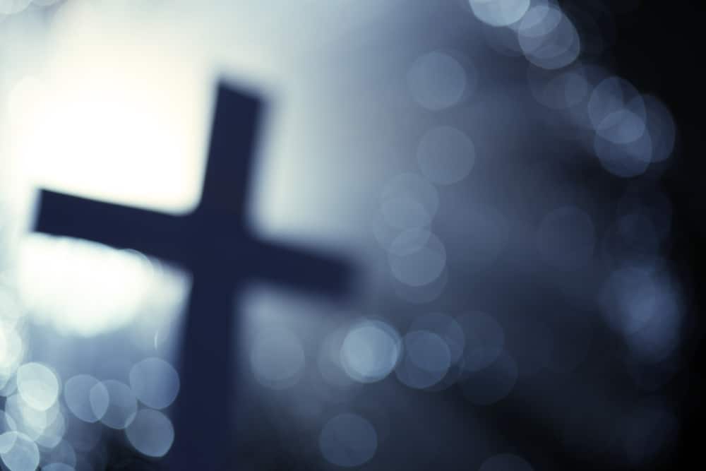 Blurry picture of cross for post Spiritual gifts: what they are, identifying and using yours