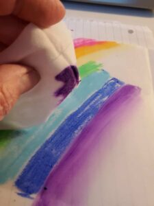 using a baby wipe to smooth gelatos for a Bible journaling with vellum page
