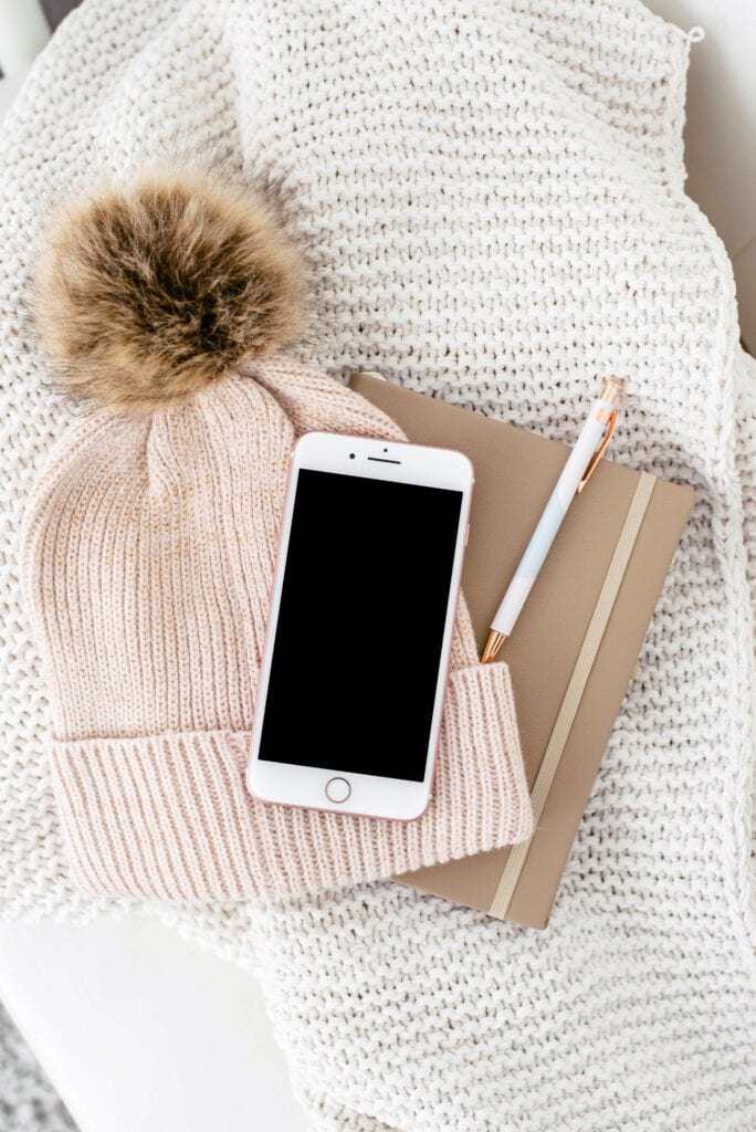 a hat and cell phone