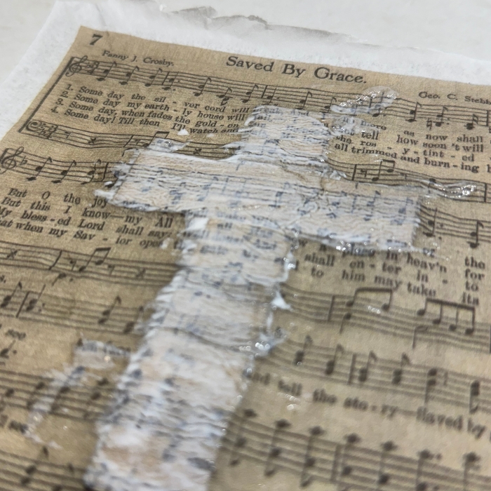 wet mod podge drying over napkin for Christian decoupage projects