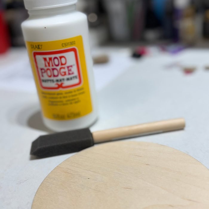 mod podge, foam brush and wood circle for easy Christian craft