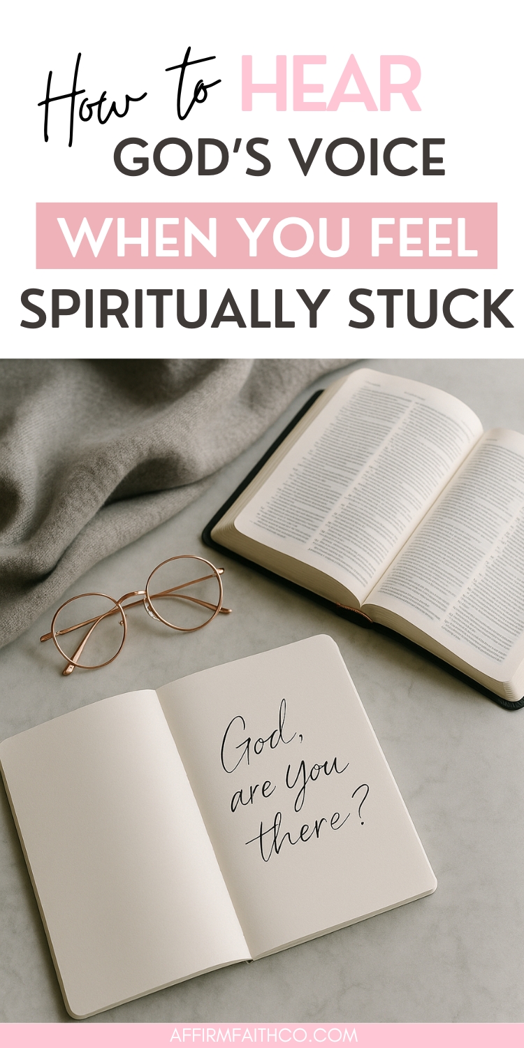 Flat lay of an open Bible, rose gold glasses, and a journal with the handwritten question 'God, are You there?' on a soft gray surface, accompanied by the text 'How to Hear God's Voice When You Feel Spiritually Stuck' – image from AffirmFaithCo.com."