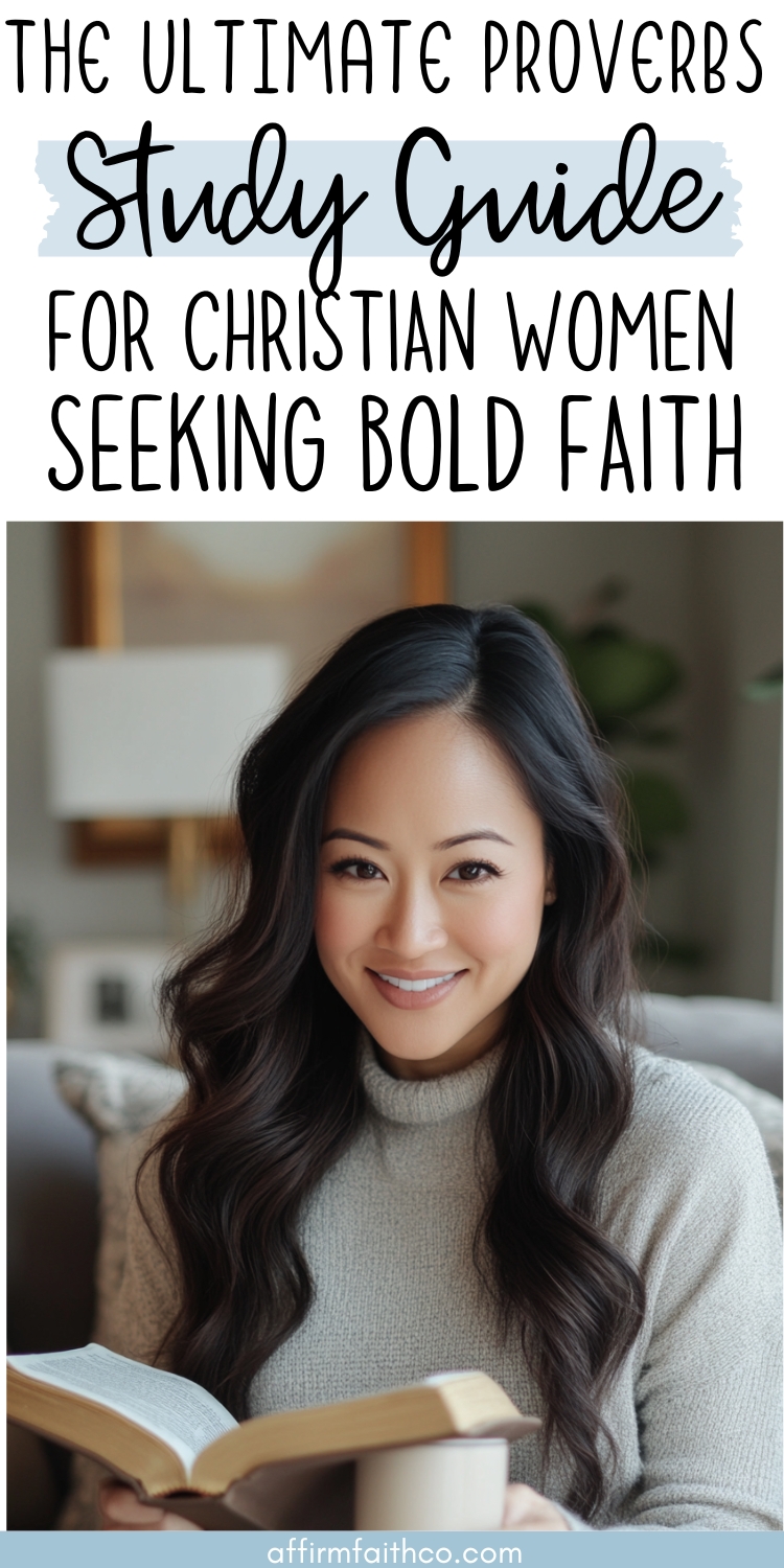 Smiling Asian woman in a cozy gray sweater holding an open Bible and a coffee mug, seated in a modern living room. Text overlay reads: 'The Ultimate Proverbs Study Guide for Christian Women Seeking Bold Faith.' Image by affirmfaithco.com