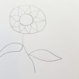 Bible Journaling Drawings: Simple & Beautiful Ways to Worship Through Art (Even If You’re Not an Artist) 4 Bible journaling sunflower sketch with added petal outlines around the center circle, drawn in pencil with stem and leaves